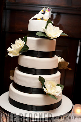 Black and white wedding cake made by bridesmaid