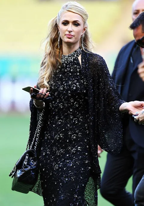 Prince Albert II of Monaco chats to Paris Hilton during the 22nd World Stars football match at the Stade Louis II in Monaco