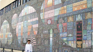 The wall of paintings in Alexandria square amazes people’s eyesight.