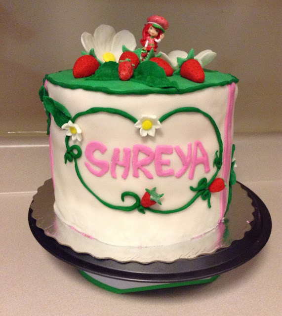 birthday cake with layers and fondant decorations