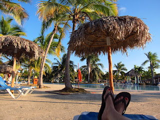 Playa Pesquero pool area and Kat's feet at rest