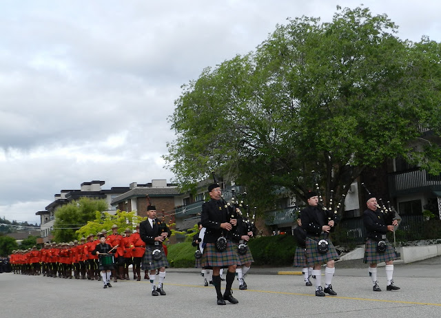 the Pipe Band leads the RCMP parade down Battle Street in Kamloops.