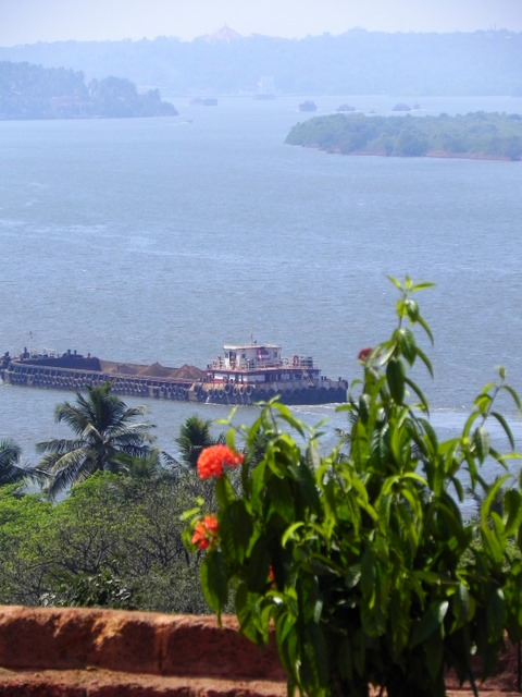 GOA, INDIA:  A barge meanders down a river towards The Arabian Sea. / @JDumas