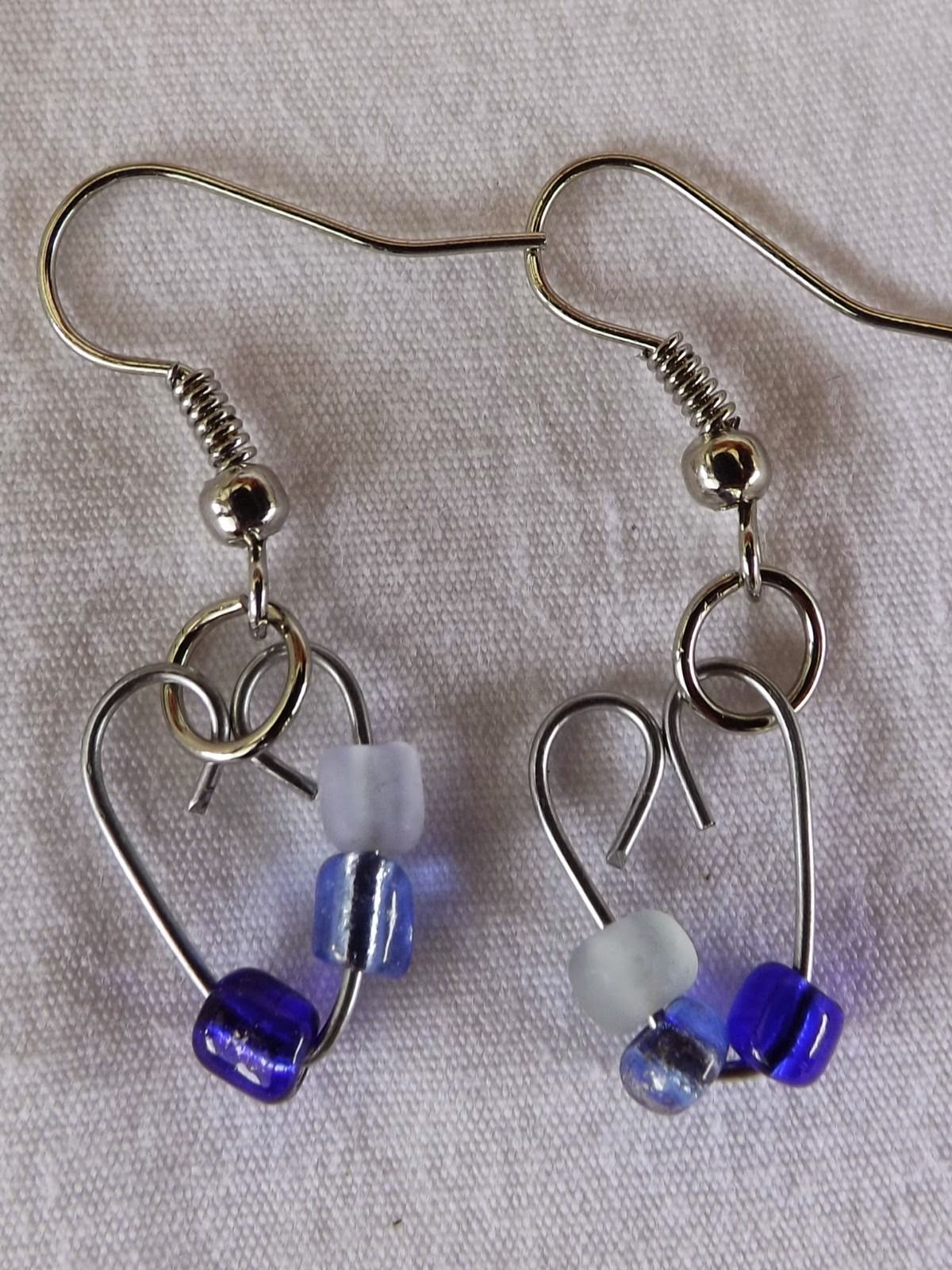 http://www.ebay.com/itm/Single-Heart-Earrings-Handmade-glass-dangle-with-stainless-steel-hook-/261770359867?fb_action_ids=318221801699656&fb_action_types=og.shares