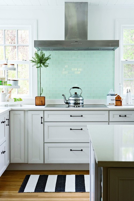 Fresh turquoise glass tile splashback in this kitchen shot by Aimée Herring for "The Happy Home Project" book published by Filipacchi Publishing (via Houzz).