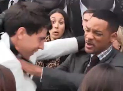 Will Smith gets kissed by red carpet reporter