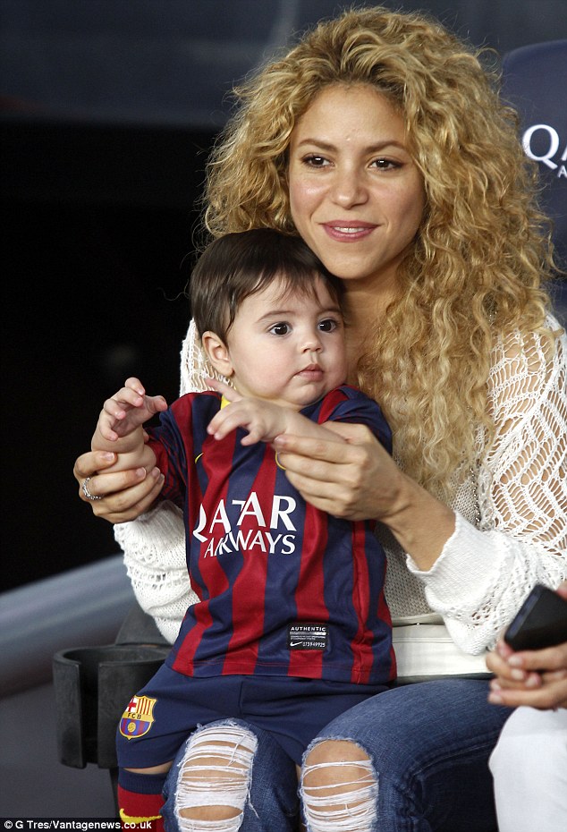 Shakira cheers on husband Gerard Pique alongside baby Milan... who