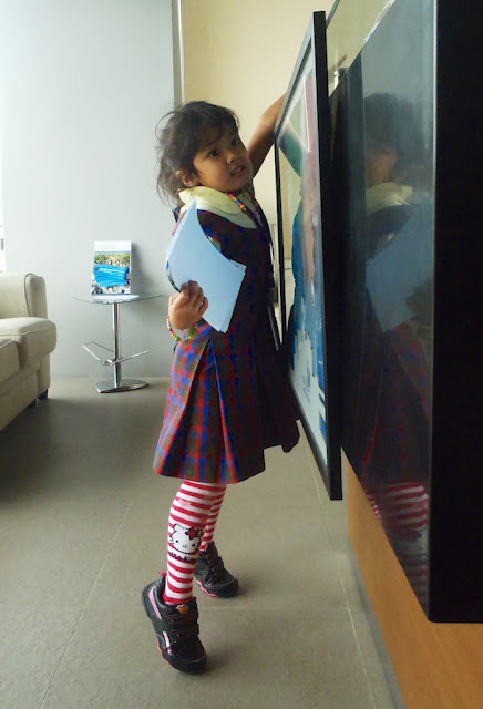 Kecil in school uniform at the doctor's office