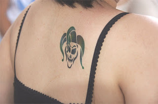 upper back clown tattoo