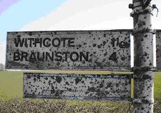 Slurry covered sign - before project Sign bespattered with farm slurry, and badly faded, BEFORE