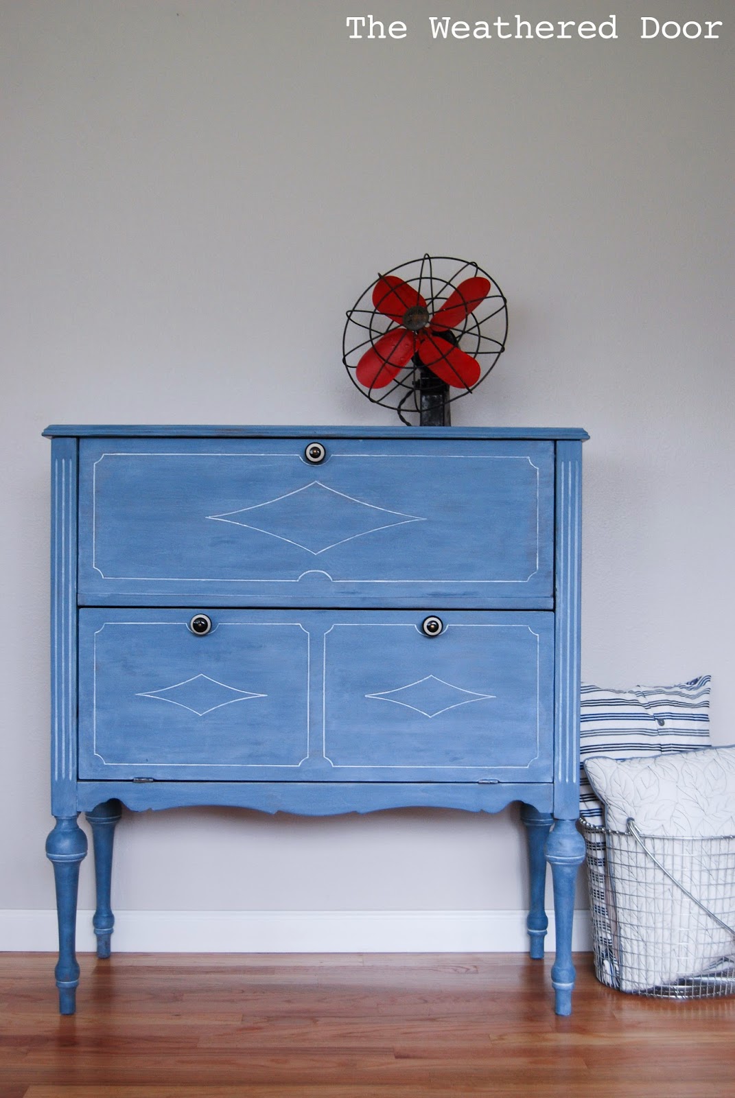 A Soldier Blue Milk Paint Cabinet With A White Wax Finish The