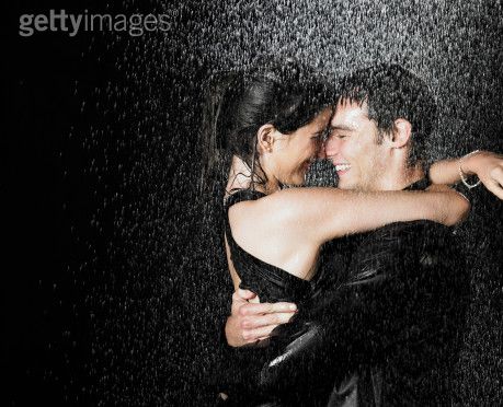 couple holding hands in rain. Holding hands, getting closer