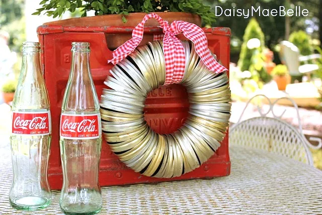 Make a 5 minute canning jar lid wreath by Daisy Mae Belle, featured on I Love That Junk
