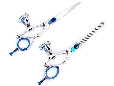 ordinary scissors and are designed to serve the purpose of thinning 