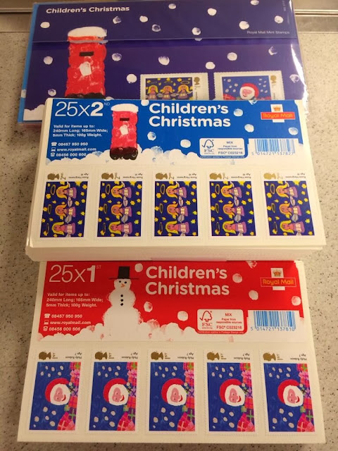 Presentation pack and folded stamp sheets for children's design christmas stamps.