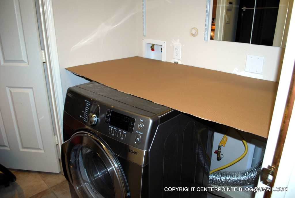 Hack a removable IKEA countertop over the washer and dryer
