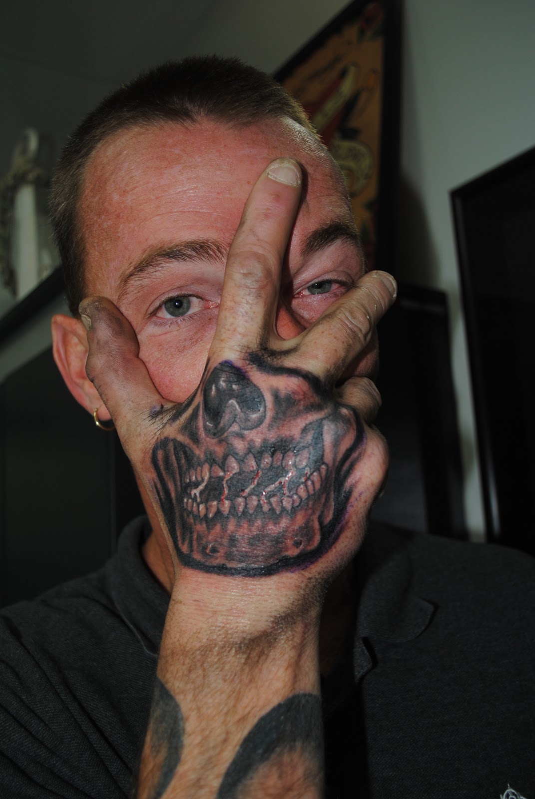Skull Hand Face Tattoo