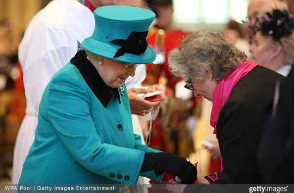 Queen Elizabeth II gives out Royal Maundt money during the Traditional Royal Maundy Service at Sheffield Cathedral 