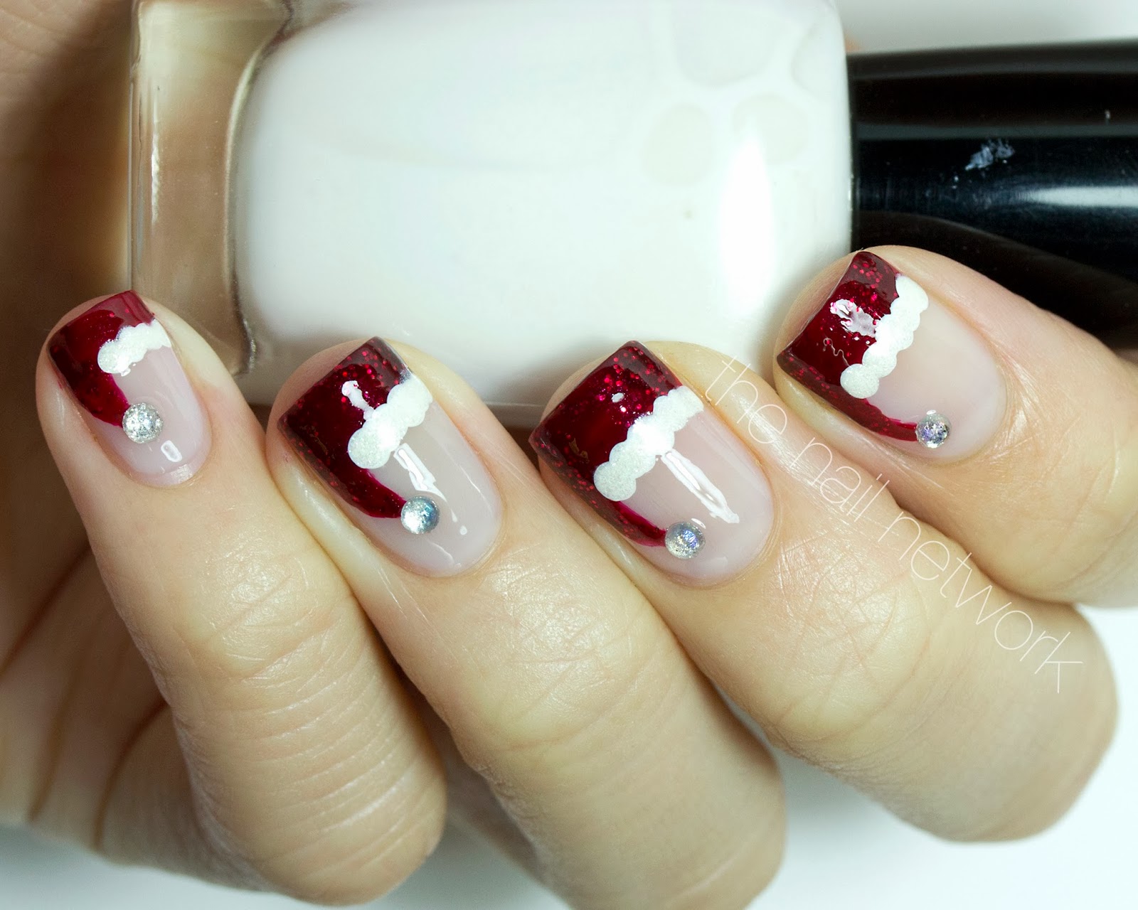 5. Red and White Santa Hat Nail Designs - wide 1