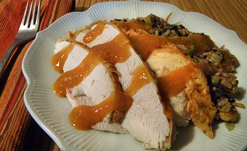 Plate of White Chicken Meat and Stuffing with Orange Wine Sauce