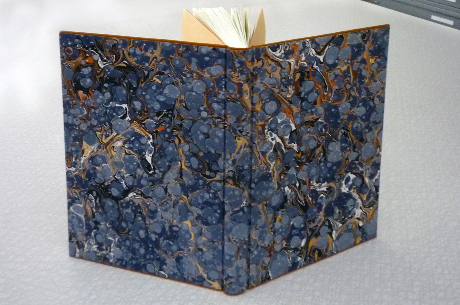 Bookbinding: Marbled Paper and Cloth Joint, The inside of a…