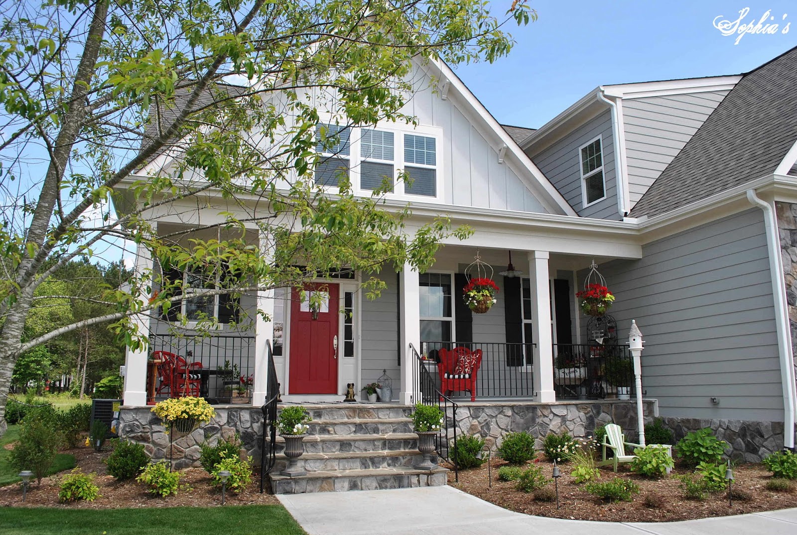 Sophia S Farmhouse Style Front Porch With Pops Of Red