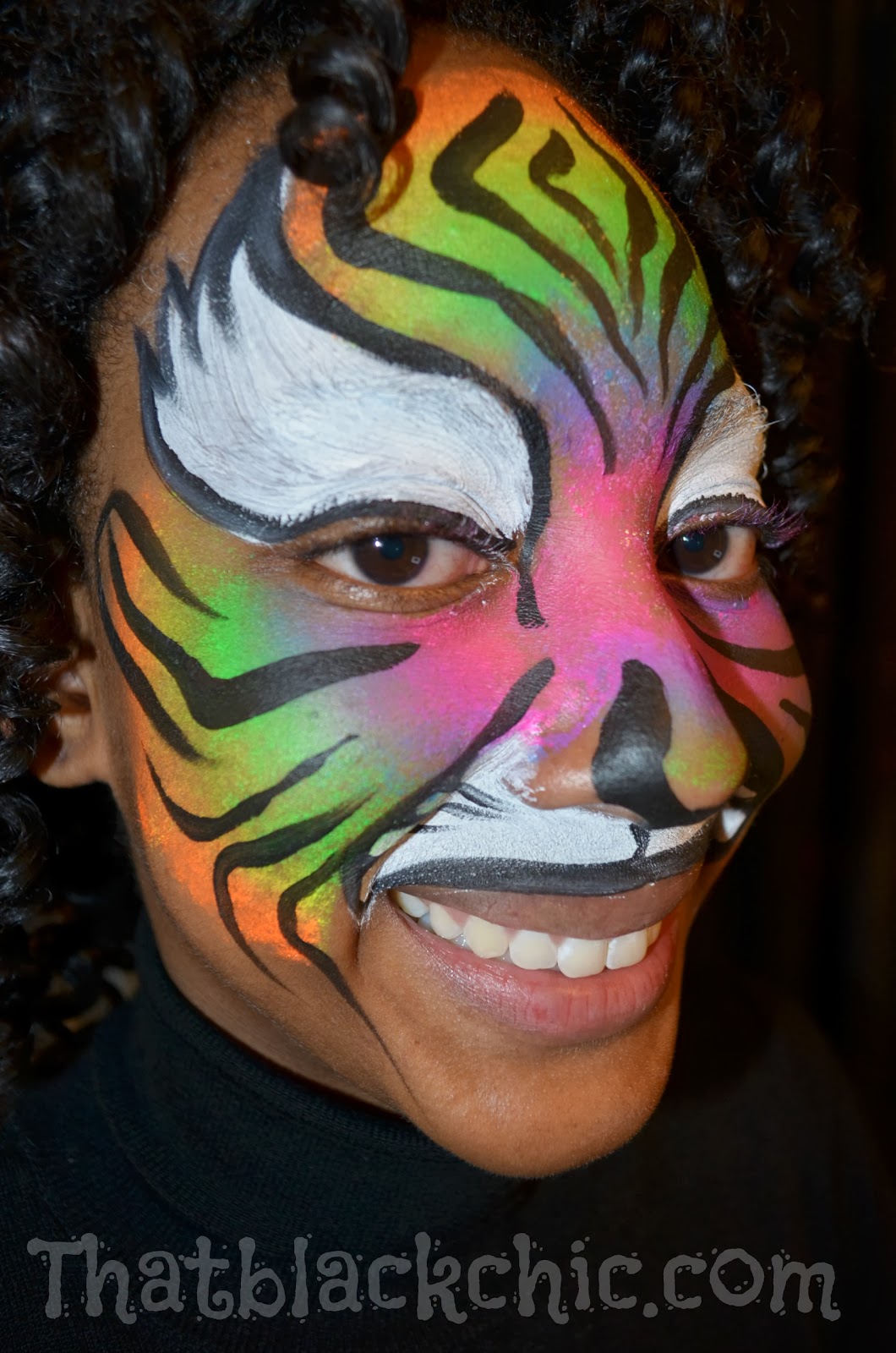 Giving back by volunteering Face Painting the kiddies That Black Chic