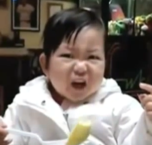 baby ekspression face eating lemon sour