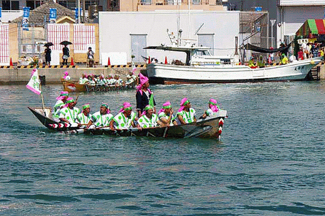 pink and green uniforms, sabani boat, team