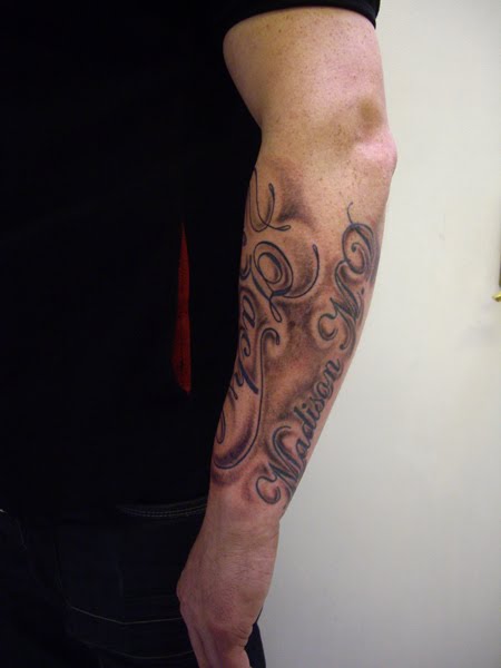 Large names and shading forearm tattoo Or pledging your allegiance to your