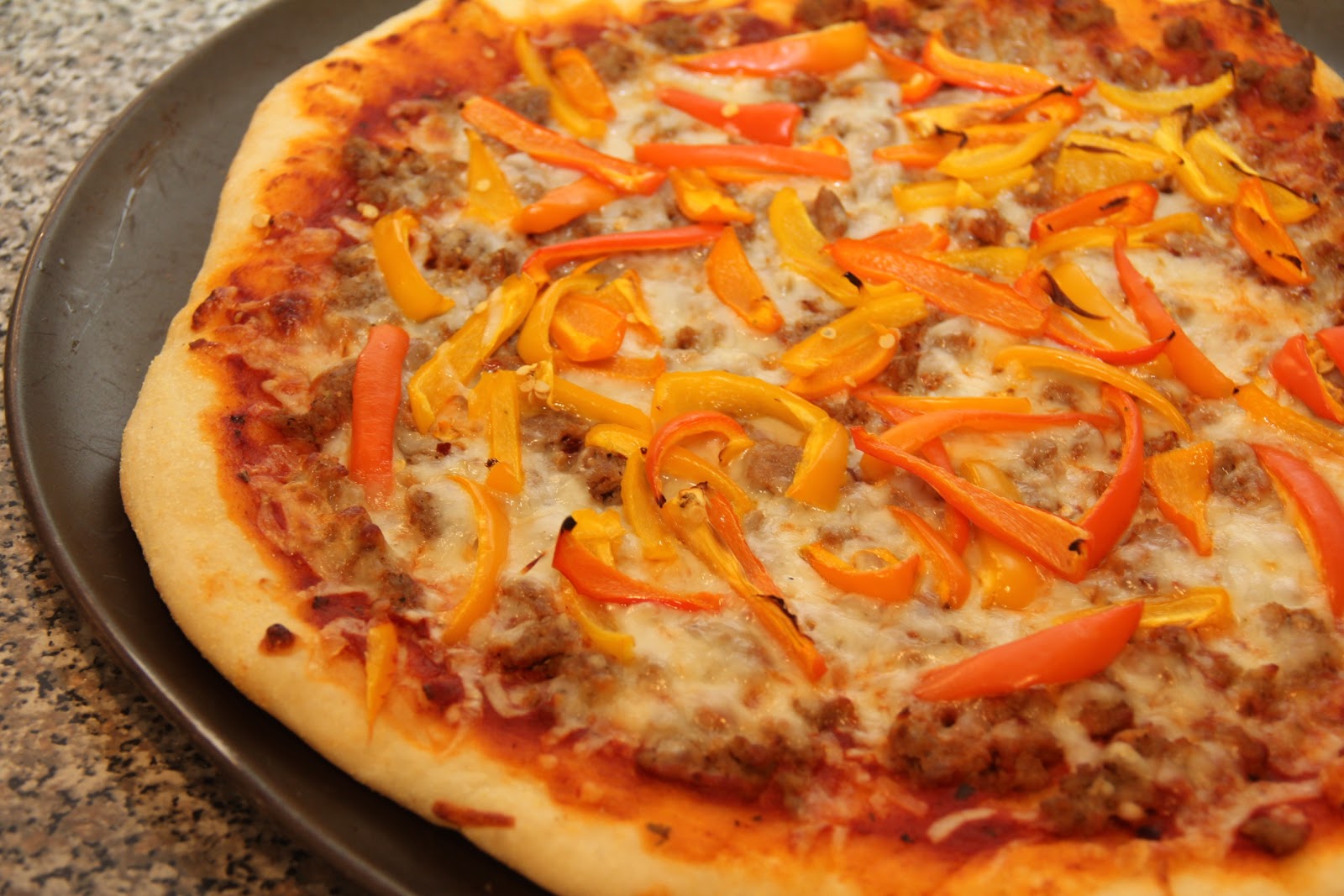 Dalia's Delights Spicy Sausage and Sweet Pepper Pizza