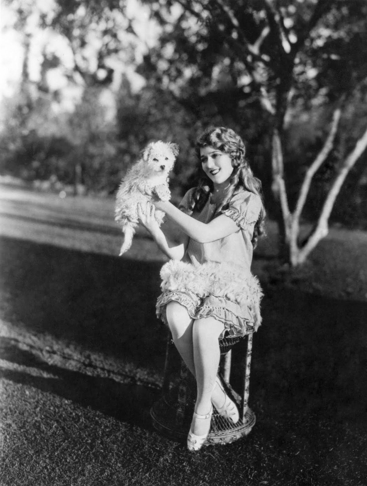 Mary Pickford and her dog at her estate, Pickfair