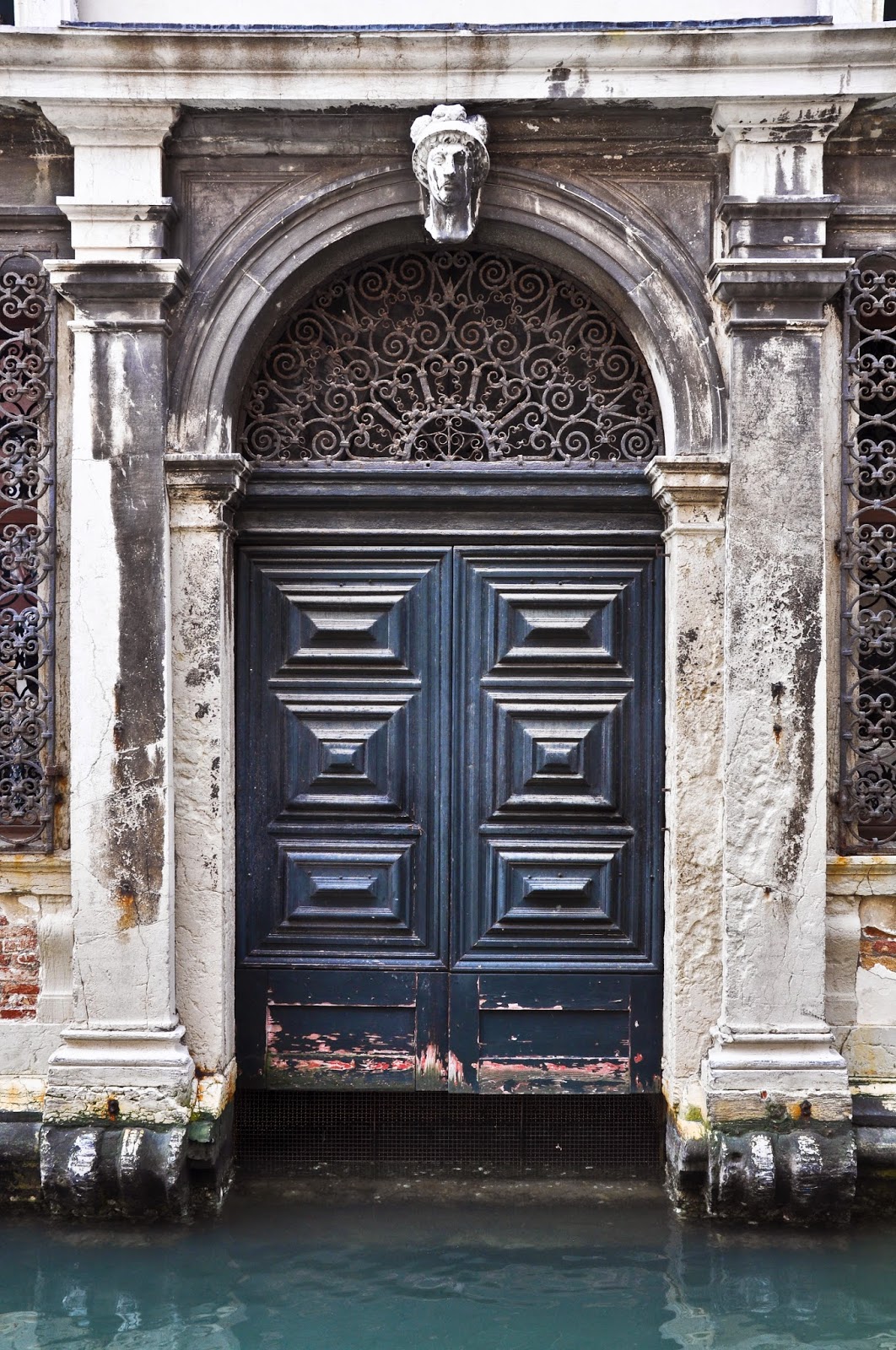 A door leading to a canal in Venice