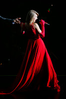 Taylor Swift wearing a glamorous red gown 