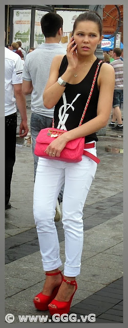 Girl in white pants on the street