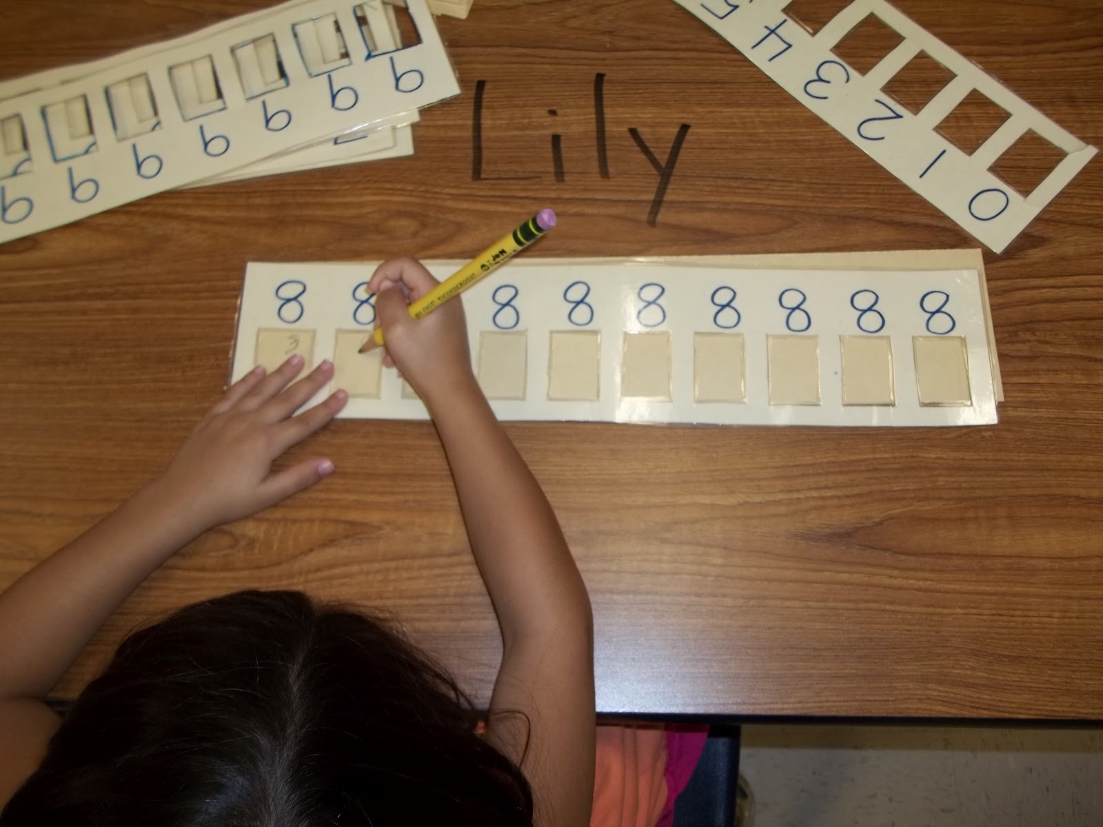 Math Tubs in Kindergarten Printing Numbers