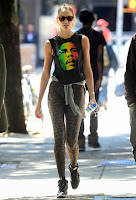 Candice Swanepoel  Leopard Leggings and bob marley t-shirt