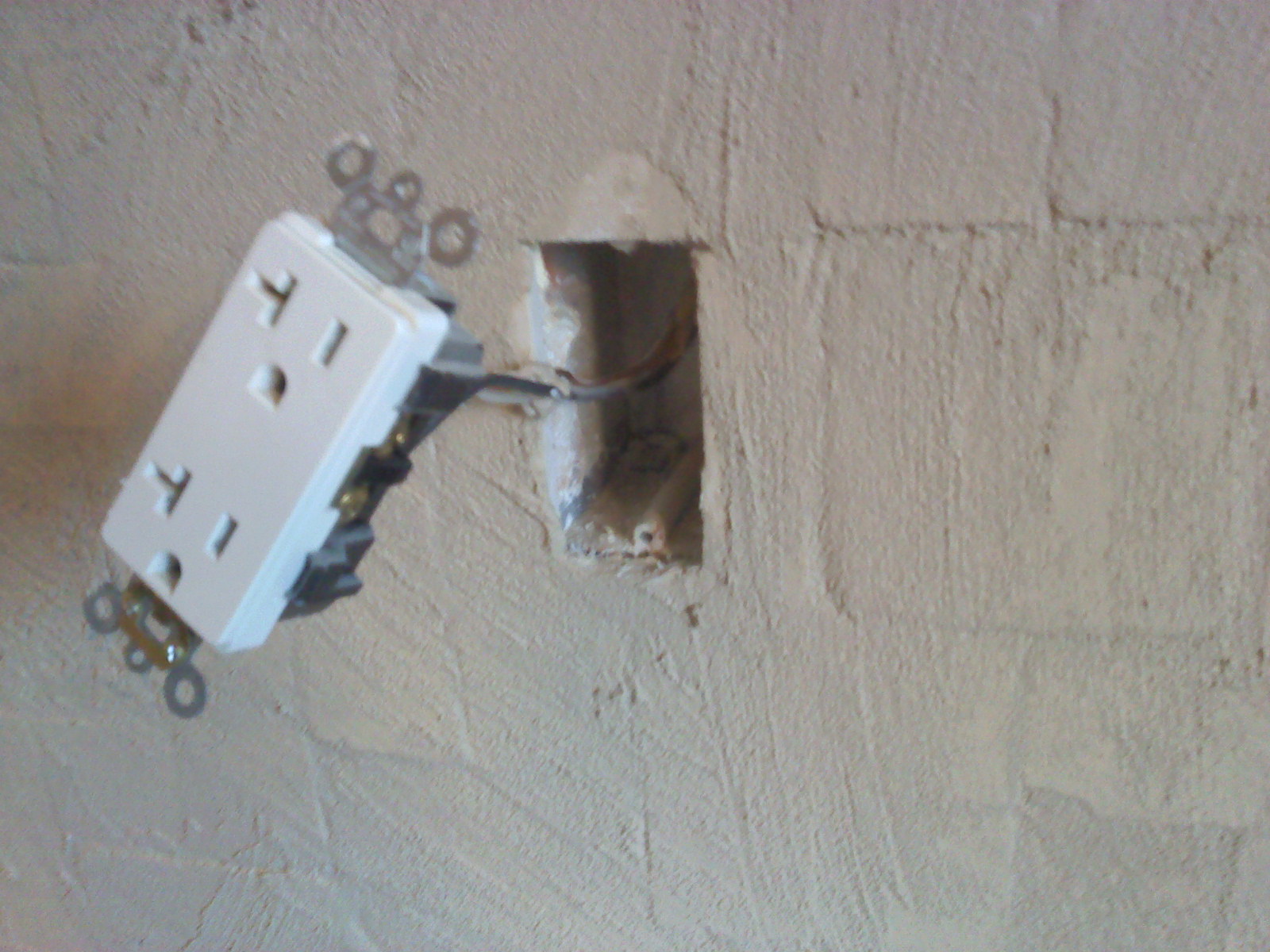 Reigna Layn Tiling Around the Electrical Outlets