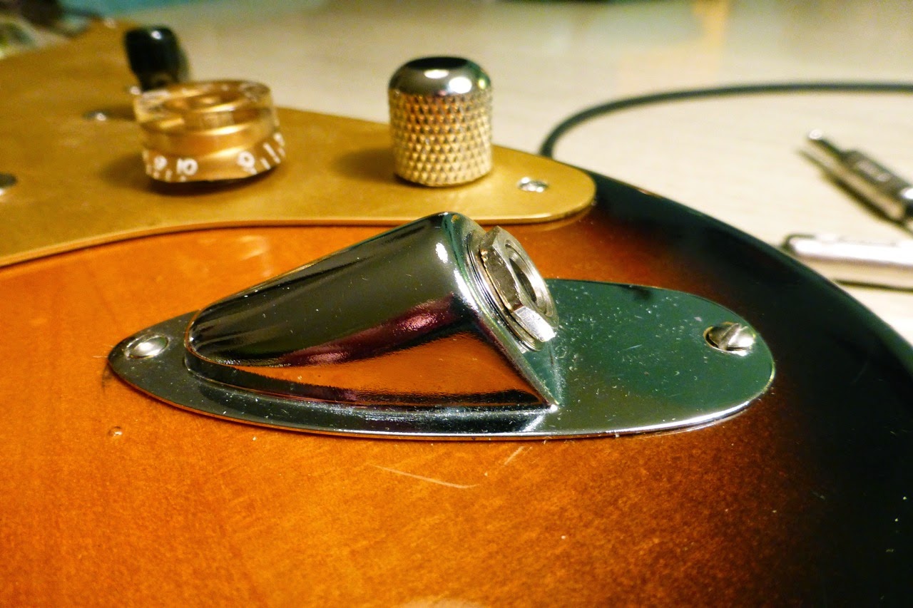 A Stratocaster with its jack plate attached inside-out.