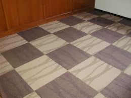 Karpet Tile adalah karpet yang berbasis modular, yang berukuran standard 50cm x 50cm dipasang berurutan seperti puzzle sesuai dengan urutan motif yang diinginkan. Karpet jenis ini merupakan technology terkini dari dunia karpet yang dapat memungkinkan pembersihan atau penggantian karpet di wilayah tertentu tanpa harus melepas secara keseluruhan. Lem khusus digunakan untuk instalasi karpet jenis ini yang memungkinkan untuk pencopotan di hari libur untuk pencucian.