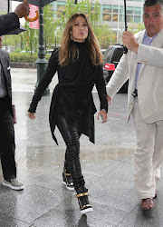 Jennifer Lopez in black outfit on a rainy day