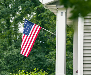 Flag flying on a front porch