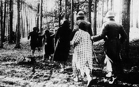 German soldiers march Polish women shot woods