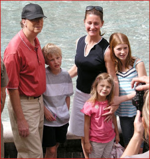 melinda and bill gates with children on beach