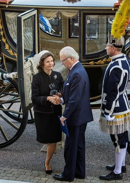 Sweden's King Carl Gustaf and Queen Silvia arrive to attend the opening of the Swedish parliament in Stockholm