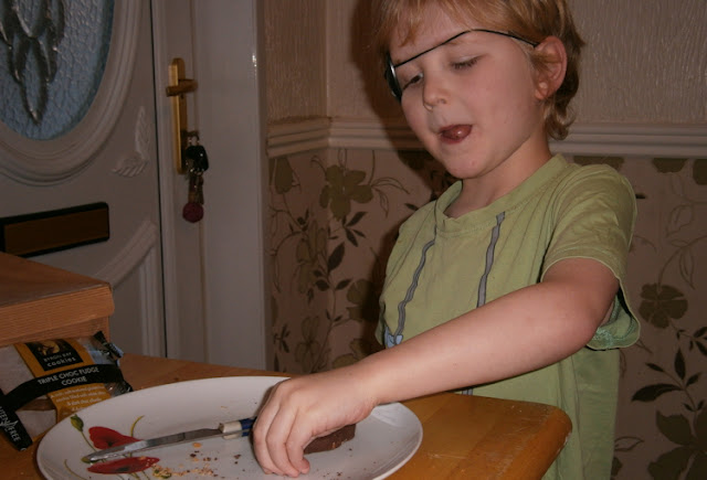 boy eating cookie crumbs