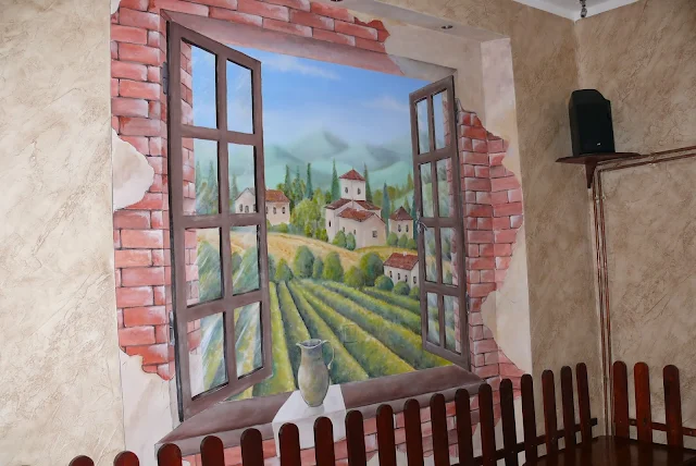 Malowanie widoku na ścianie w pizzerii, malarstwo dekoracyjne