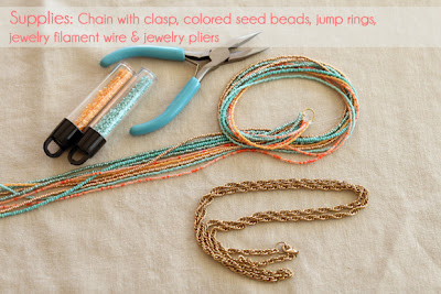 supplies for making a seed bead necklace- seed beads, gold chain, necklace wire, needle nose pliers and jump rings.
