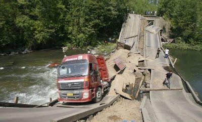 road damage from flooding