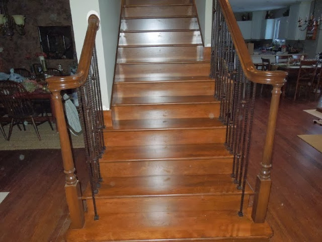See how the left side hand rail terminates into that wooden oval, which is attached through the drywall into a stud See how the left side hand rail terminates into that wooden oval, which is attached through the drywall into a stud